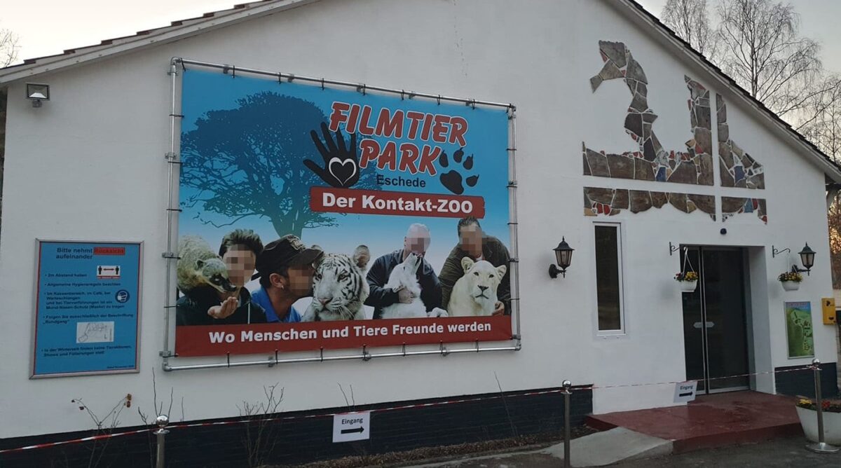 Front of a building with a banner.